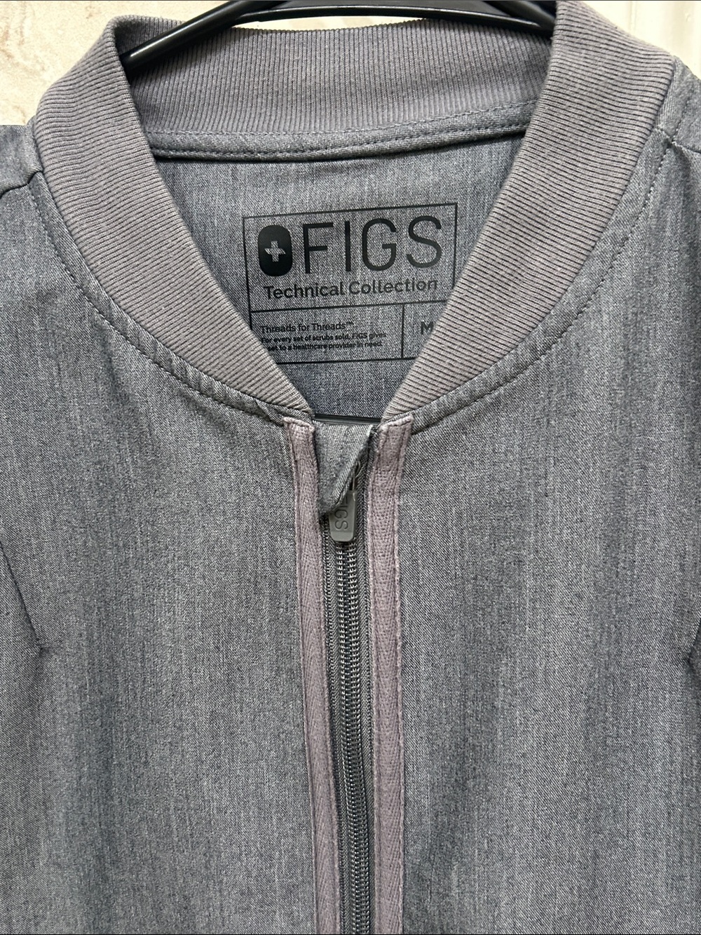 Figs brand ladies large scrub jacket, graphite.
One spot, see photo.